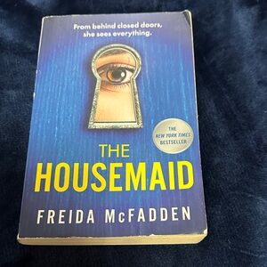 The Housemaid by Freida McFadden - Blue & Yellow Paperback Novel